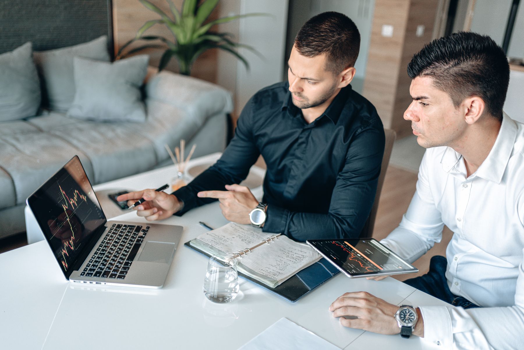 An analyst reviewing financial charts and source data