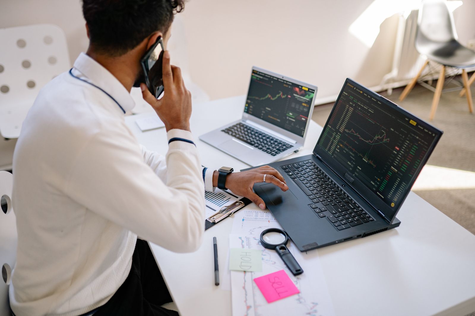 An analyst reviewing financial charts and source data