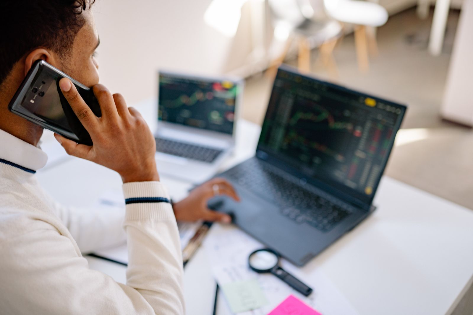 Analyst reviewing financial information during a phone call